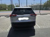 Low mileage Rav4 with rear view camera, sensor and floor mat protection.